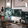black flat screen computer monitor on white wooden desk