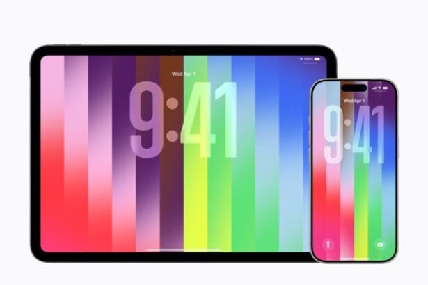 iOS 26.5 Pride Luminance Wallpaper auf iPhone-Lockscreen mit dynamischen Farbverläufen.